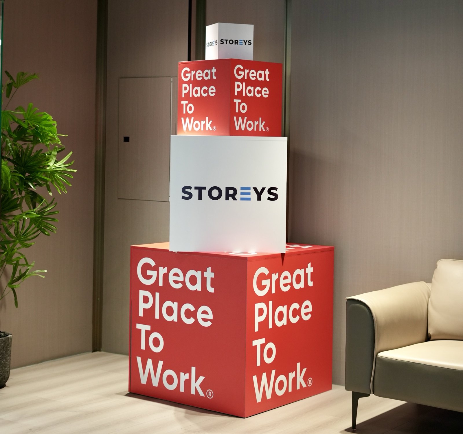 Great Place To Work award display at the Storeys office